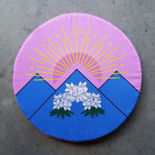Printed shield cover sunrise over mountain flowers