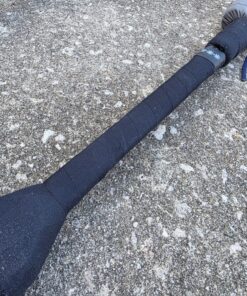 40" Down Stick with oblong handle and Flat pommel laying on concrete with the wide orientation