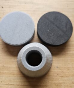Pommel Kits (7/8" ID) 6lb gumdrop, 4lb disc, and 2lb disc placed individually on a wooden table