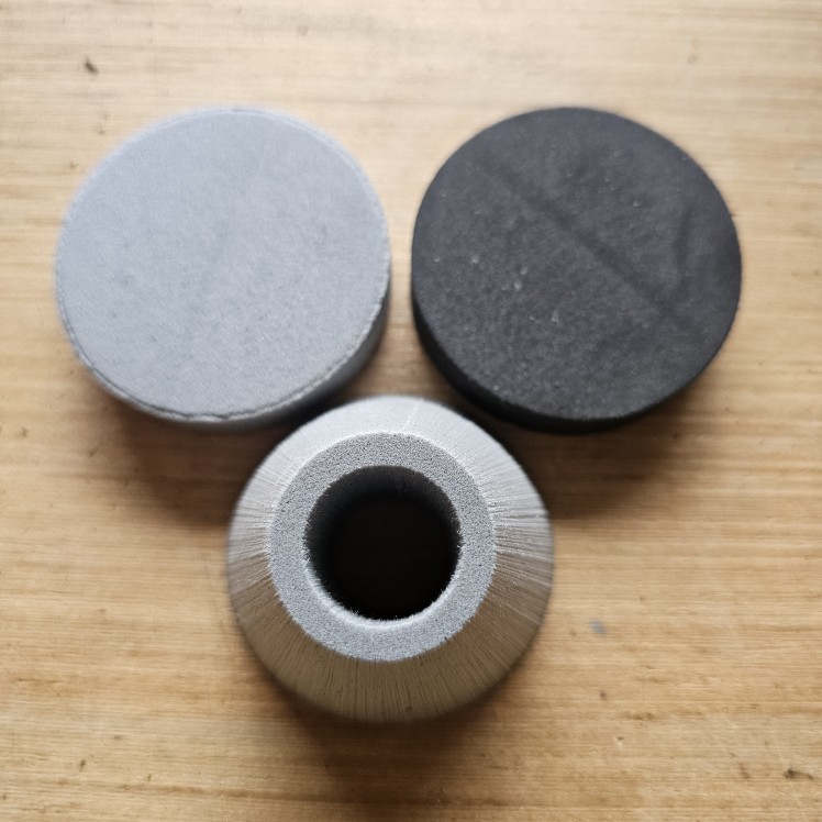 Pommel Kits (7/8" ID) 6lb gumdrop, 4lb disc, and 2lb disc placed individually on a wooden table