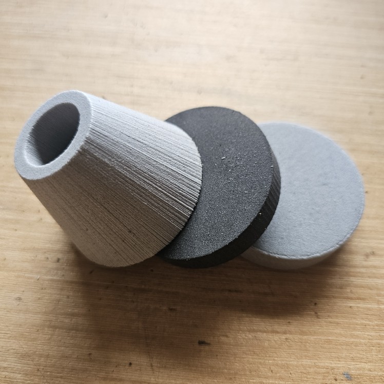 Pommel Kits (7/8" ID) Three pieces of round foam leaning on each other on a wooden table